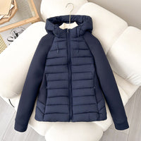 Damen leichte Hybrid-Steppjacke mit Kapuze und elastischen Ärmelpaneelen - Navyblau
