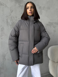 Damen Oversized Steppjacke mit Kapuze und integrierten Taschen - Grau