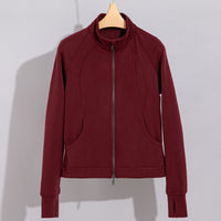 Damen Performance-Trainingsjacke mit Stehkragen und Daumenloch Nord Taschen - Bordeauxrotes Oberteil
