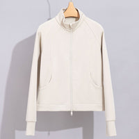 Damen Performance-Trainingsjacke mit Stehkragen und Daumenloch Nord Taschen - Mandelfarbenes Oberteil