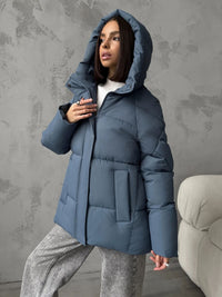 Damen Oversized Steppjacke mit Kapuze und integrierten Taschen - Blau