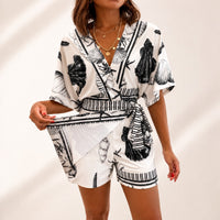 Azzurine™ Skort-Jumpsuit Mit Wickeloptik, Seitlicher Bindung Und Exklusivem Mediterranem Print - Schwarz