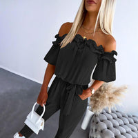 CAMILA – Schicker Off-Shoulder Volant-Hüftgurt-Jumpsuit - Schwarz