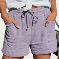 Damen Shorts mit elastischem Bund und Kordelzug sowie aufgesetzten Taschen und umgeschlagenen Säumen - Lila