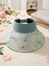 Faltbarer Strohhut mit Blumenakzent und UV-Schutz - Blau