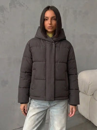 Damen Oversized Steppjacke mit Kapuze und integrierten Taschen - Braun